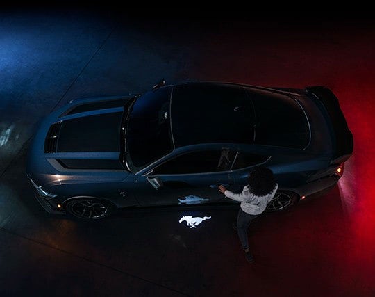 2024 Ford Mustang® Dark Horse™ model with a driver approaching the vehicle | Visalia Ford in Visalia CA