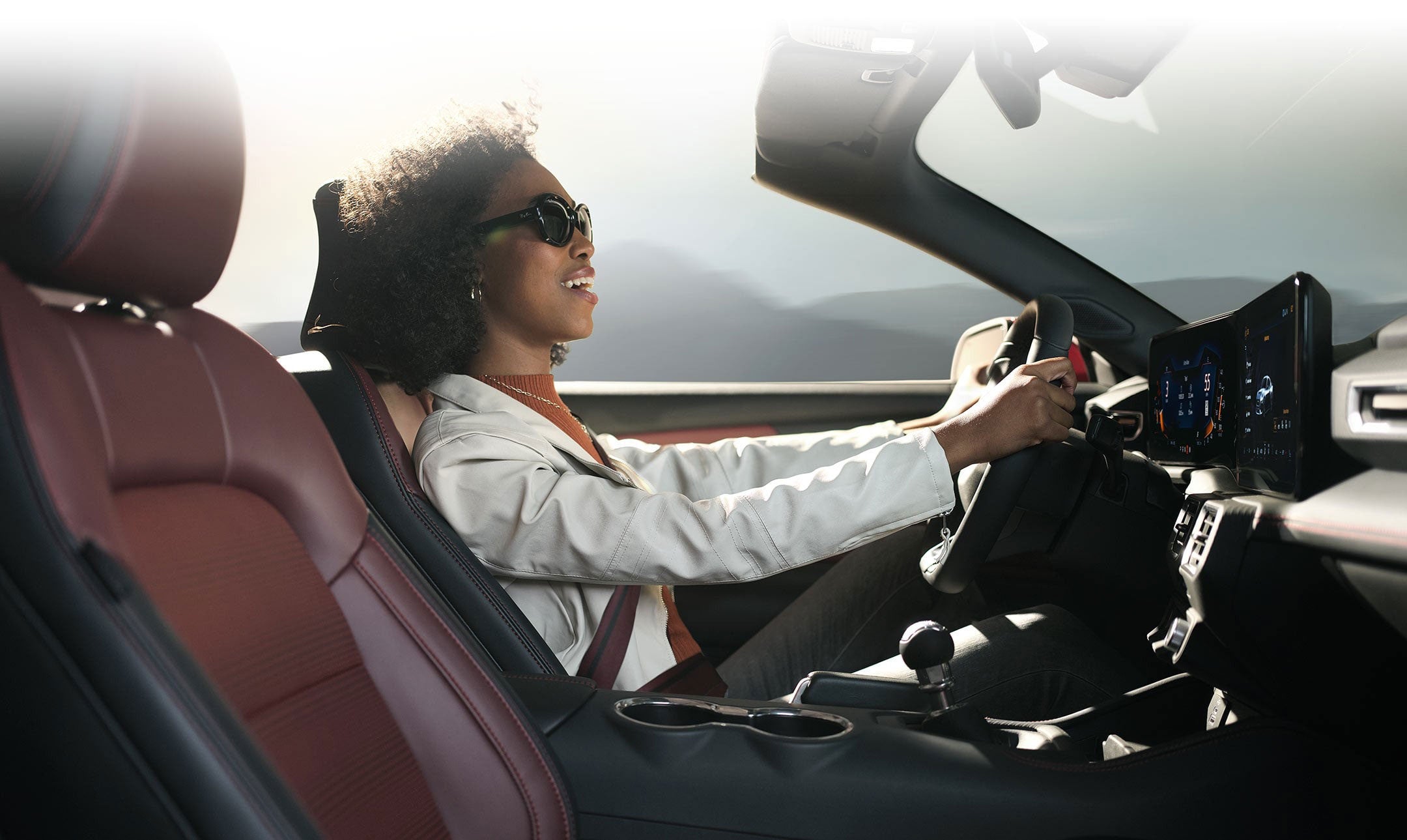 Person sitting in the driver’s seat of a 2024 Ford Mustang® convertible | Visalia Ford in Visalia CA
