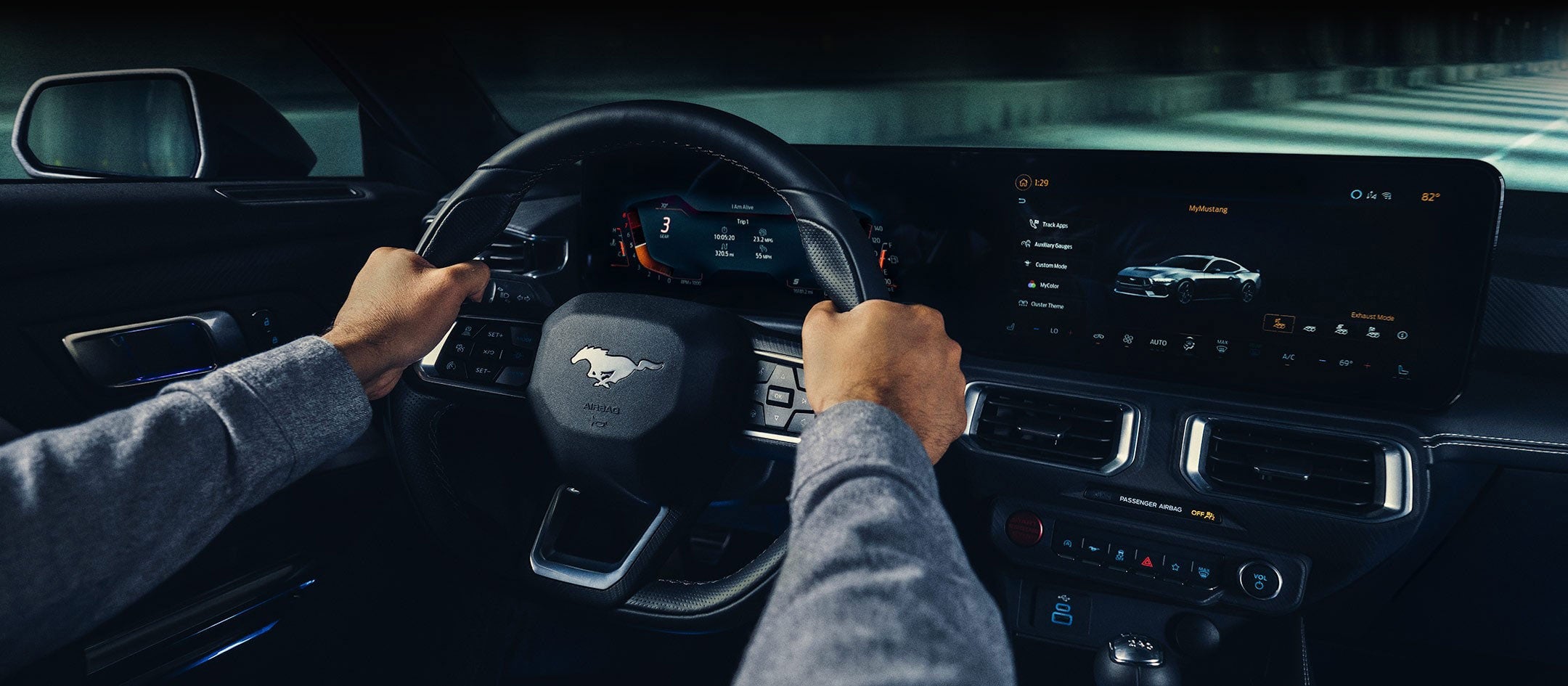 A 2024 Ford Mustang® model interior with a person driving | Visalia Ford in Visalia CA